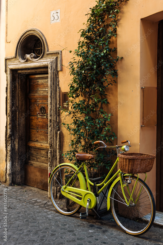 Old street in Trastevere in Rome, Italy, stylish bycice parked in front of shop entrance Old street in Trastevere in Rome, Italy, stylish bycice parked in front of shop entrance
