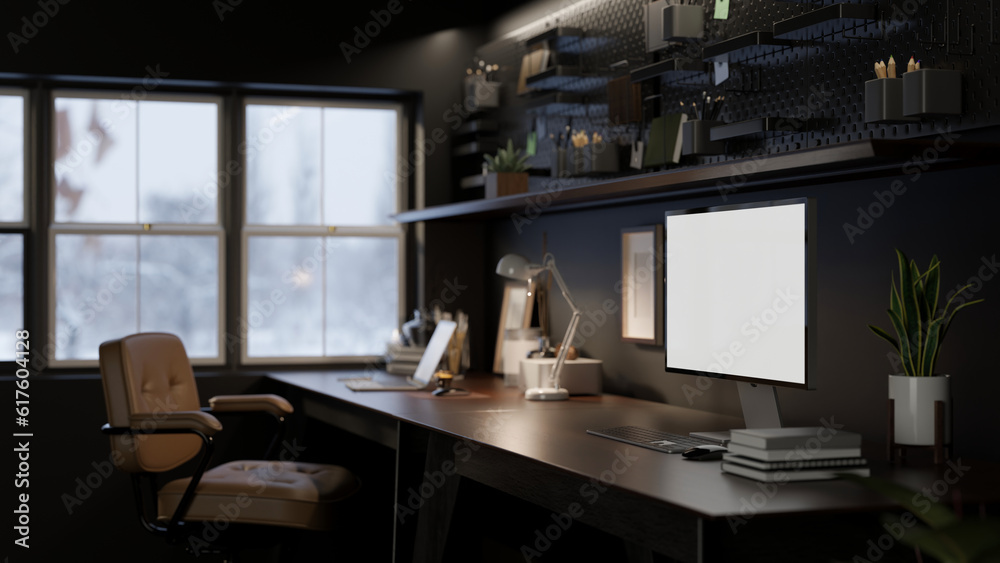 Interior design of a modern dark loft home office with computer mockup on a dark wooden table