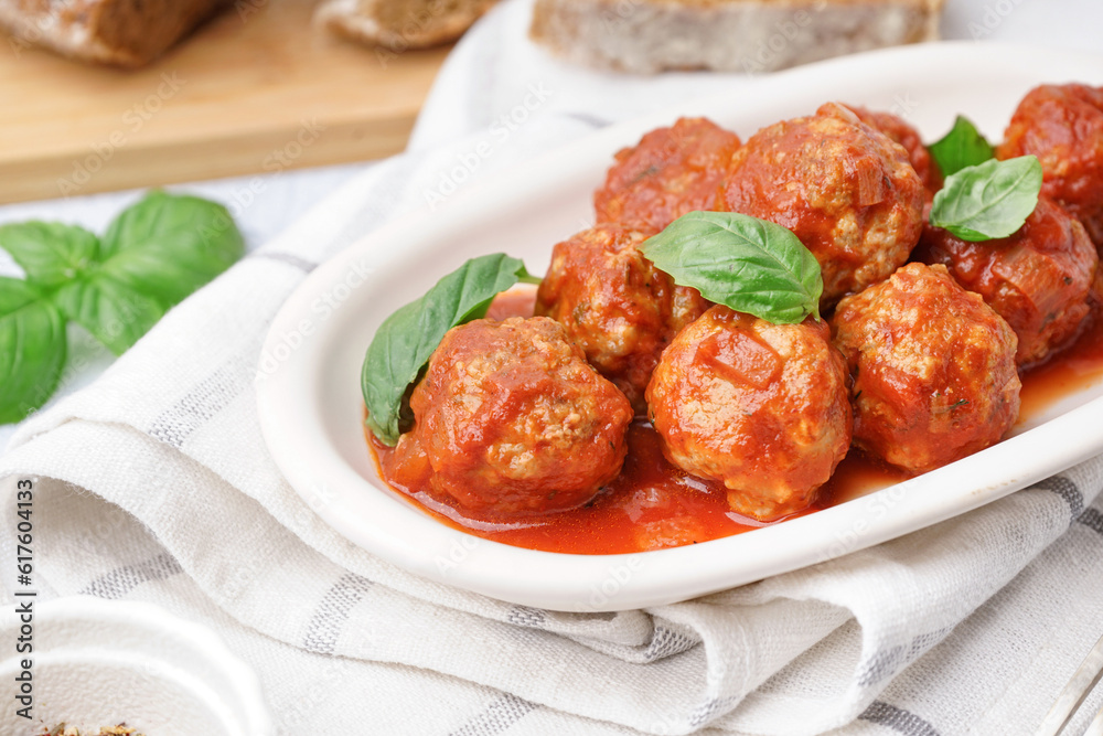 Plate of tasty meat balls with tomato sauce and basil, closeup Plate of tasty meat balls with tomato sauce and basil, closeup