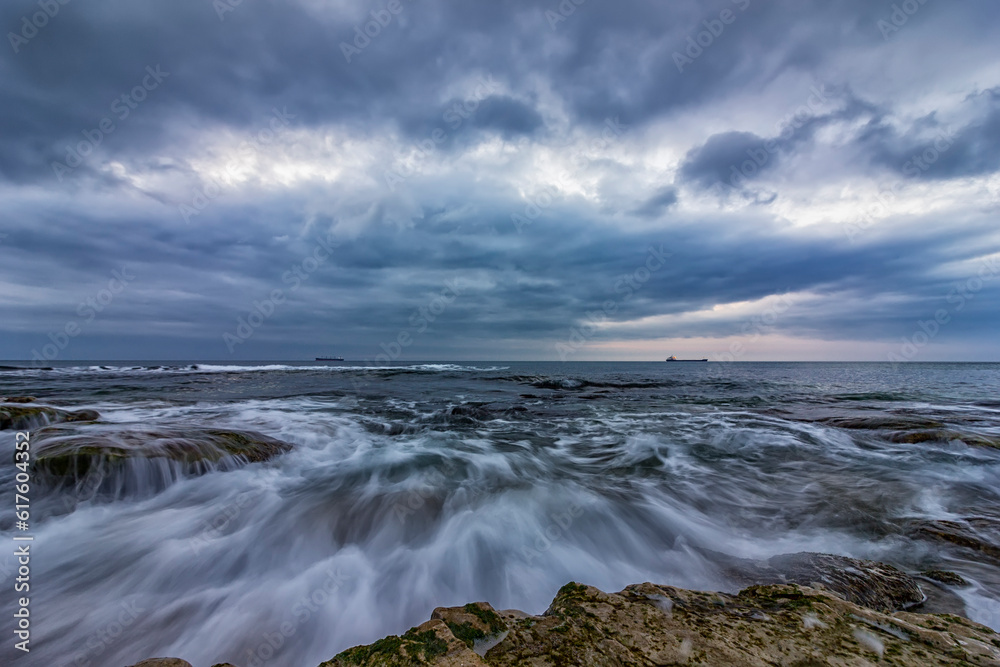 Stunning long exposure cloudy sunset seascape. Stunning long exposure cloudy sunset seascape.