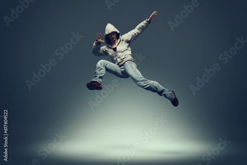 Hip hop dancer jumping and performing some of his dance. This is a 3d render illustration