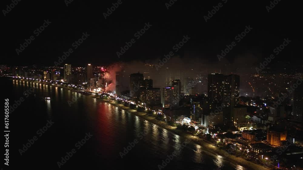 Night city life, lighting and salute drone view. Firework in nighttime metropolis, aerial footage. Night city life, lighting and salute drone view. Firework in nighttime metropolis, aerial footage.