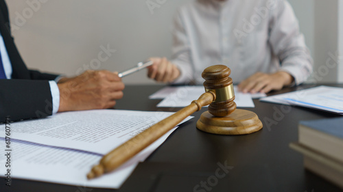 Concept of lawyer counseling  Businessman receives a pen from senior lawyer to signing contract