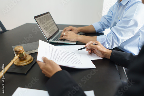 Lawyer and legal concept, Businessman typing on laptop as senior lawyer explain detail of contract