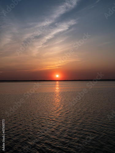 Beautiful sunset on the lake in summer