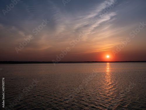Beautiful sunset on the lake in summer