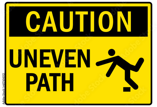 Slip and trip hazard sign and labels uneven path