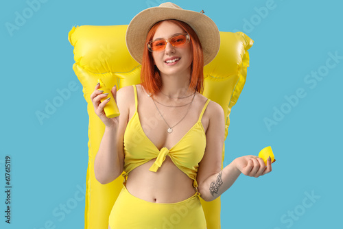 Young woman with sunscreen ...