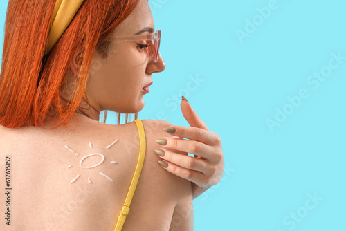 Young woman with sun made o...