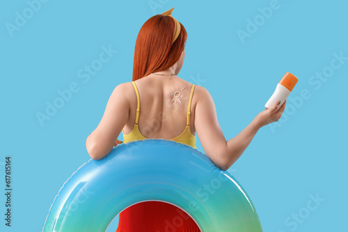Young woman with sun made o...