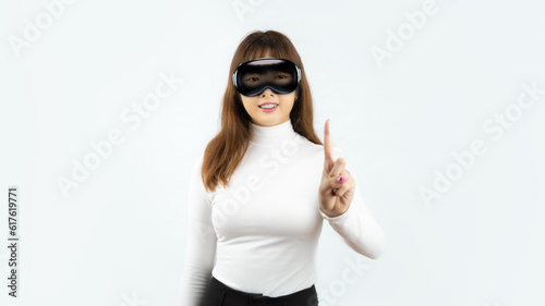 Asian woman wearing AR glasses vision pro and pointing finger isolated on white background