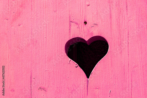 picturesque heart shape at an old wooden window shutter in the Vosges region in France