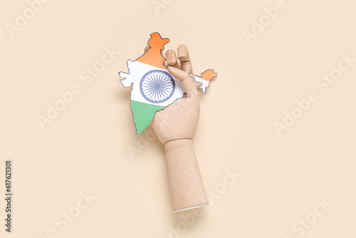 Wooden hand with paper Indi...