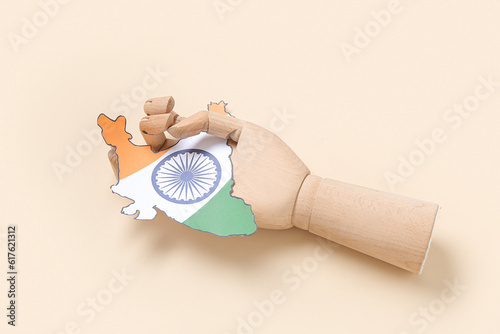 Wooden hand with paper Indi...