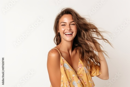 Portrait of a beautiful young woman with flying hair on white background