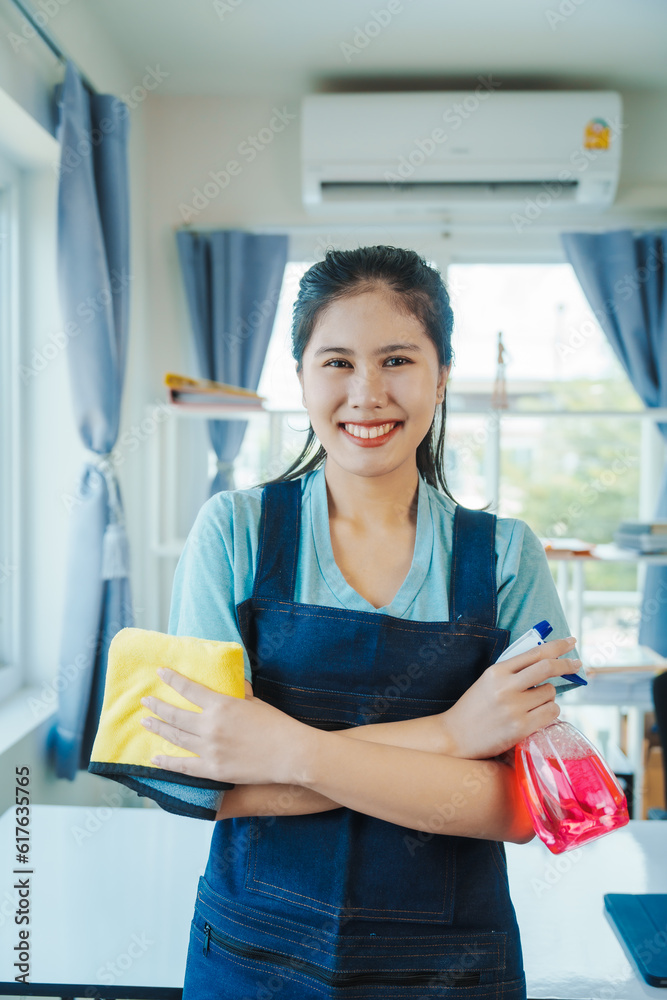 Cleans floor and desk. Hand of asian chinese woman wiping work desk, close-up. Cleans floor and desk. Hand of asian chinese woman wiping work desk, close-up.