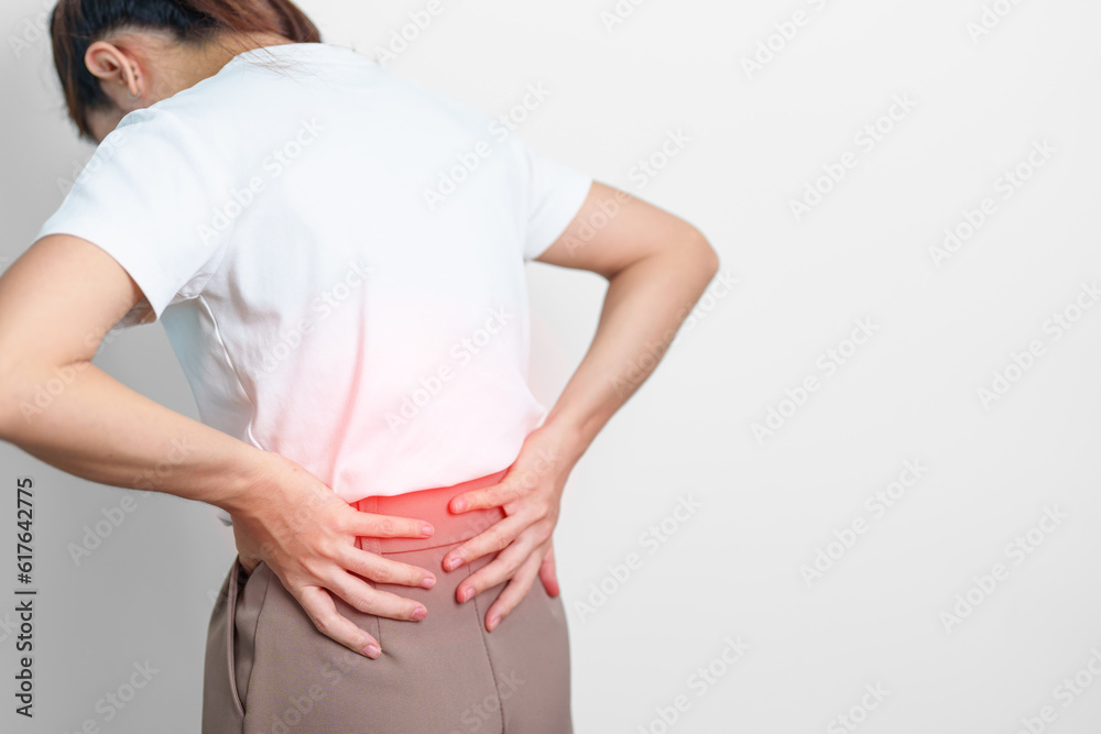 adult female with muscle pain on gray background. Elderly woman having back body ache due to Piriformis Syndrome, Low Back Pain and Spinal Compression. Office syndrome and medical concept adult female with muscle pain on gray background. Elderly woman having back body ache due to Piriformis Syndrome, Low Back Pain and Spinal Compression. Office syndrome and medical concept