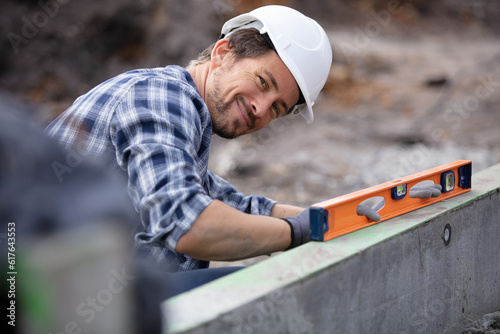 civil engineer measuring with a tubular spirit level