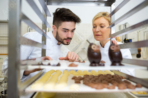Photography drying the designed chocolates on the racks