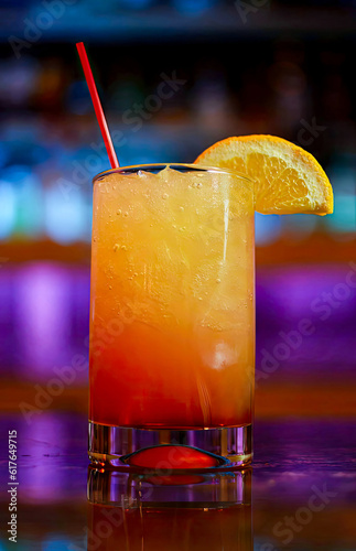 Drink, Sex on the beach cocktail, Mai Tai, Pina Colada, Sidecar, Screwdriver Cocktail, Tequila Sunrise, Moscow Mule Mimosas. There is an orange peel on the edge of the glass, placed on the bar