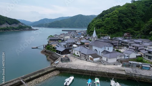 Sakitsu, Japan: Aerial drone footage of the Sakitsu village in the Amakusa island, famous for its ancient christian church, in Kyushu in southern Japan. Shot with an upward motion