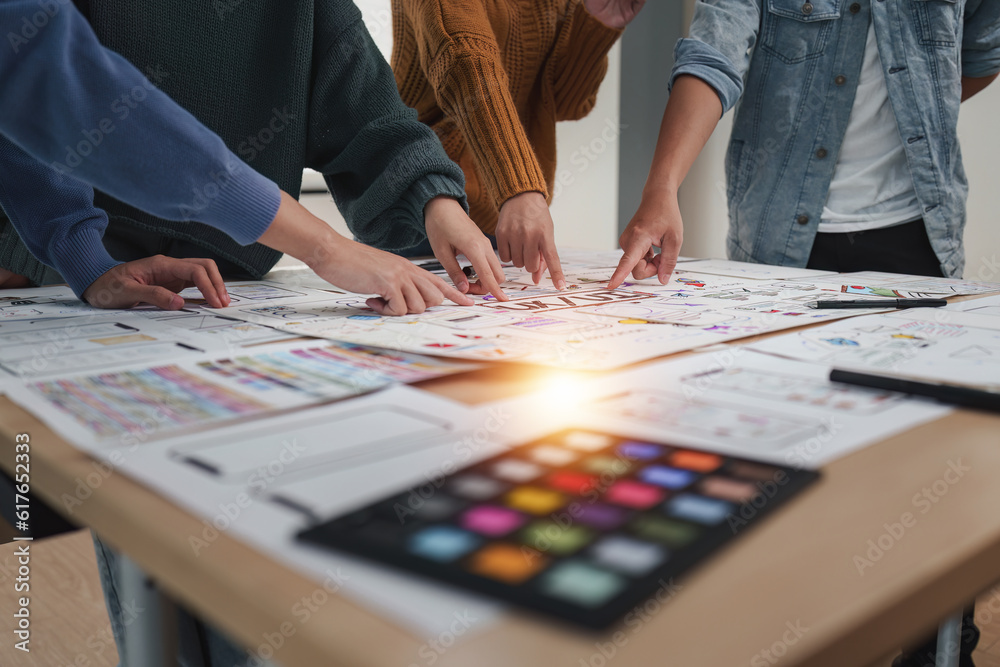 Close up ux developer and ui designer brainstorming interface wireframe design.Creative digital development agency Close up ux developer and ui designer brainstorming interface wireframe design.Creative digital development agency