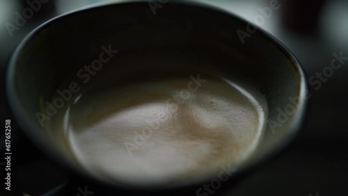 Close-up of coffee in cup, slow motion video. Coffee break, fika concept photo