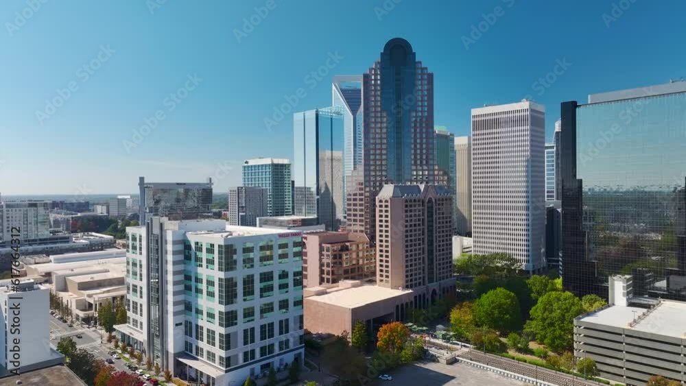 Aerial view of downtown district of Charlotte city in North Carolina, USA. Glass and steel high skyscraper buildings in modern american midtown Aerial view of downtown district of Charlotte city in North Carolina, USA. Glass and steel high skyscraper buildings in modern american midtown