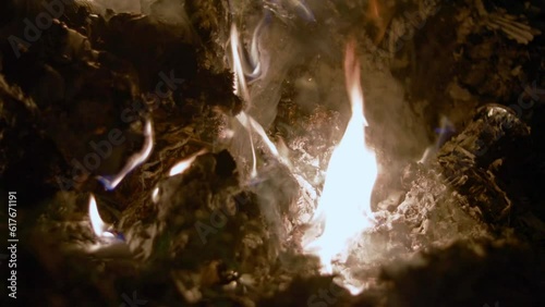 Fire burning garbage on outside at night