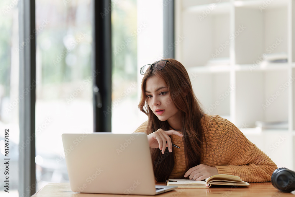 Beautiful young Asian woman college student at classroom. College student working on the college campus. back to school concept Beautiful young Asian woman college student at classroom. College student working on the college campus. back to school concept