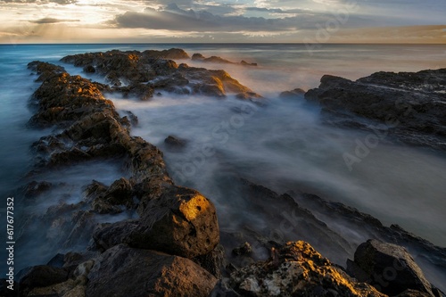 Scenic shot of a rocky beach at Snapper Rocks in Gold Coast, Queensland, Australia during sunrise