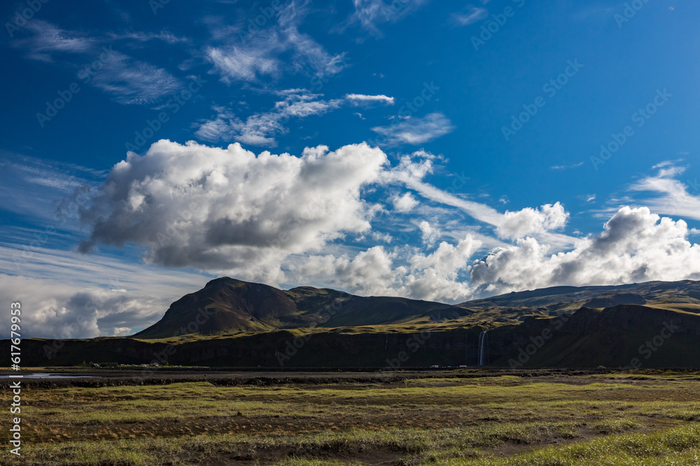 Summer travel landscape with clouds over mountains, Iceland