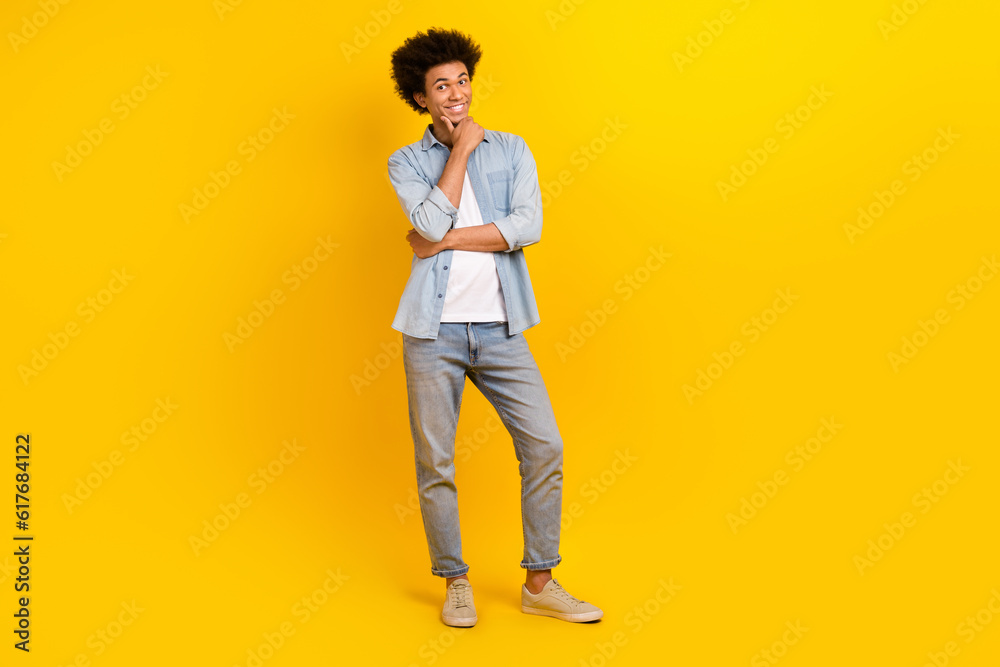 Fototapeta premium Full body portrait of cheerful person hand touch chin contemplate ponder isolated on yellow color background