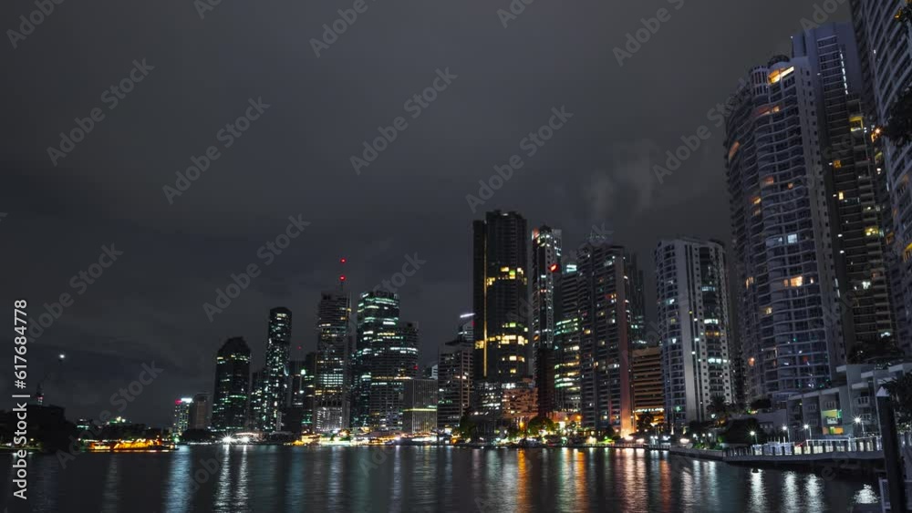 Night timelapse of Brisbane riverside riverwalk and city skyline, Australia