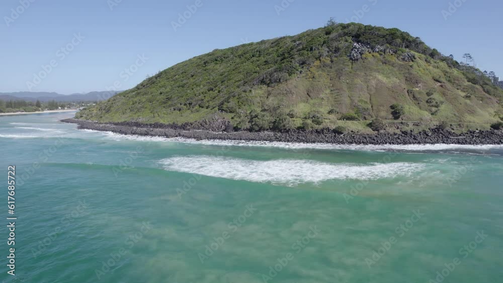 Burleigh Head National Park On Coral Sea Coast - Pristine Coastal Landscape With Lush Rainforest In Queensland, Australia. aerial pan right Burleigh Head National Park On Coral Sea Coast - Pristine Coastal Landscape With Lush Rainforest In Queensland, Australia. aerial pan right