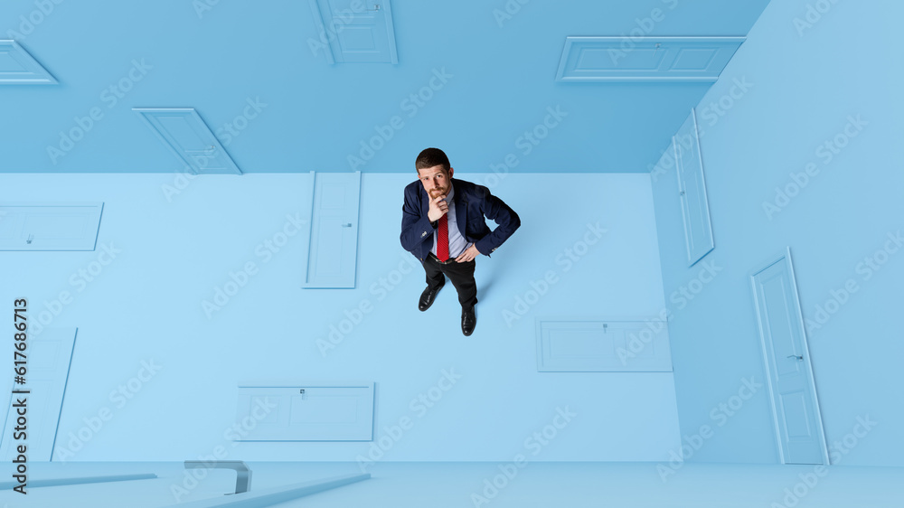 Conceptual design. Businessman with doubtful, thoughtful face standing around many closed doors over blue background. Making choice. Concept of business, sales, marketing and management, growth, ad