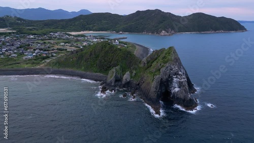 Itoshima, Japan: Aerial drone footage of the dramatic Keya no Ohto cliff and coastline in the Kyushu island near Fukuoka in Japan at dusk. Shot with an orbit motion