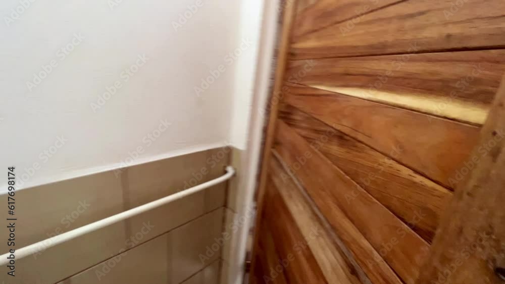 Entering a rustic bathroom inside a campsite