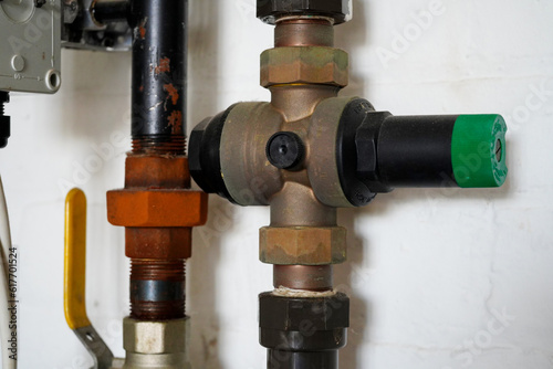 Close up of industrial pipe valves and pipes