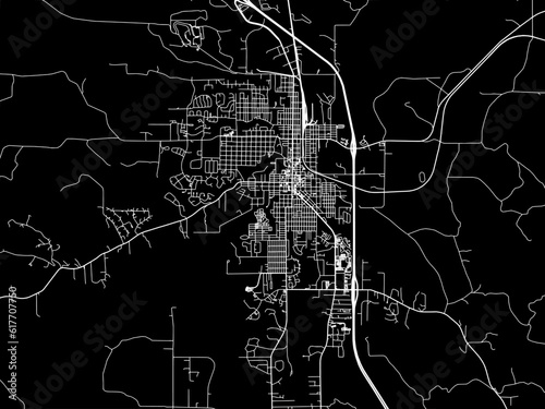 Vector road map of the city of  Sheridan Wyoming in the United States of America with white roads on a black background.