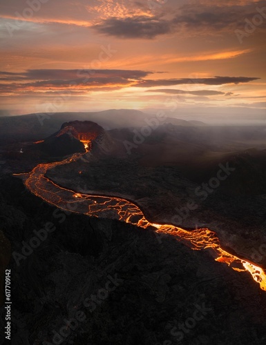A view of the eruption of Fagradalsfjall volcano in Iceland, with an orange hue emitting from lava photo