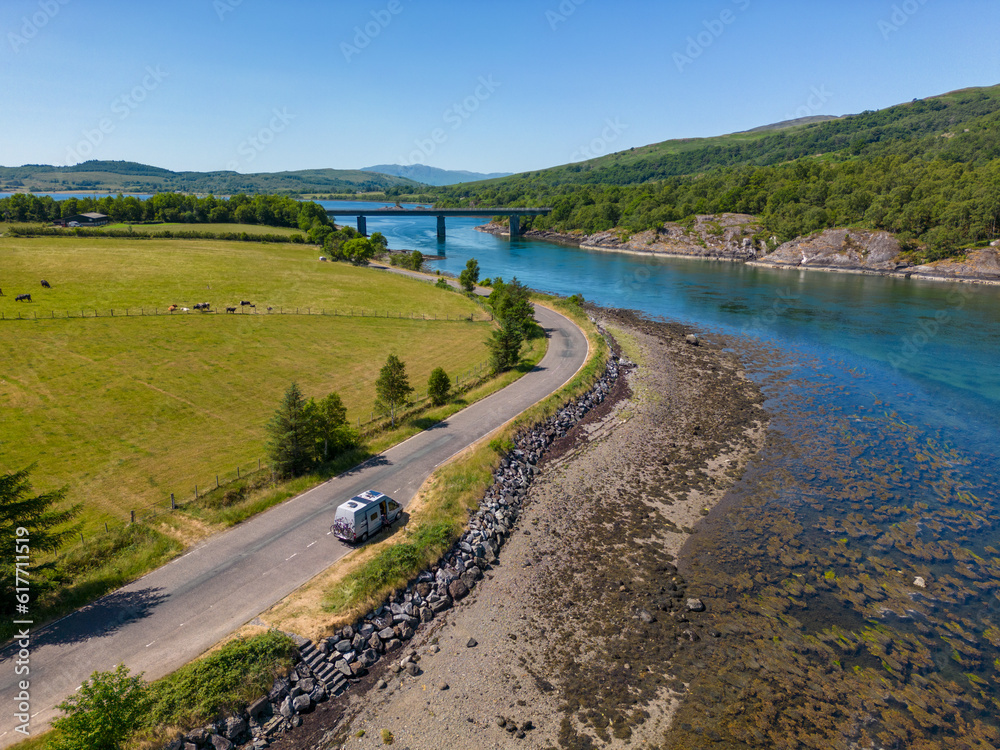Drone photo of a camper next to a beautiful Loch Creran in scotland Drone photo of a camper next to a beautiful Loch Creran in scotland