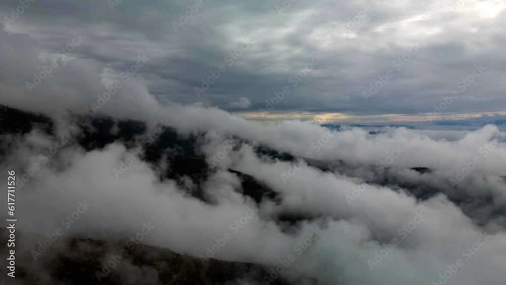Drone view over misty mountains on a cloudy day Drone view over misty mountains on a cloudy day