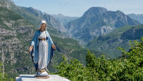 Albania SH20 road and a mini female saint statue