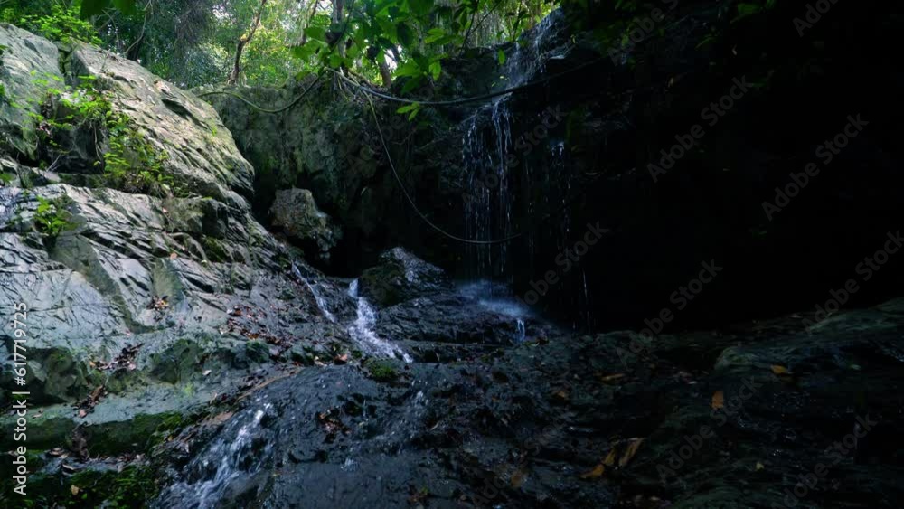 A small waterfall with streams in the jungle A small waterfall with streams in the jungle