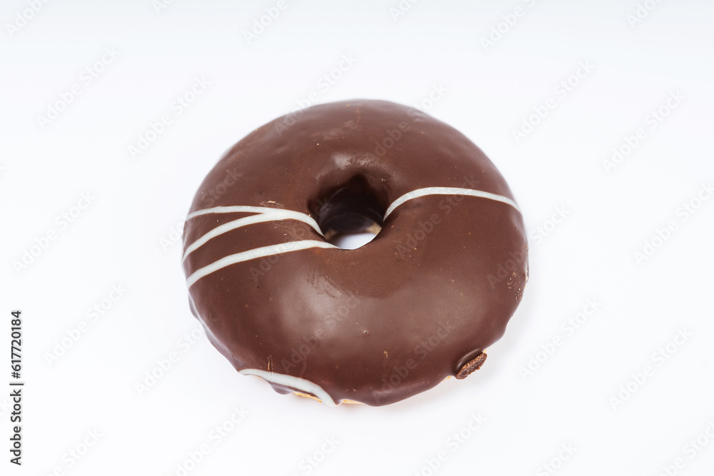 chocolate donuts on a white background. flour donuts with chocolate icing on a light background. colorful pastries chocolate donuts on a white background. flour donuts with chocolate icing on a light background. colorful pastries