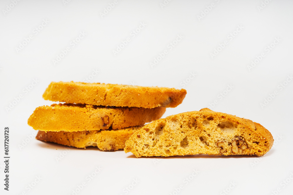 baked slices of bread with nuts on a light background. sweet white bread cooked in the oven. flour sweets on a white background baked slices of bread with nuts on a light background. sweet white bread cooked in the oven. flour sweets on a white background