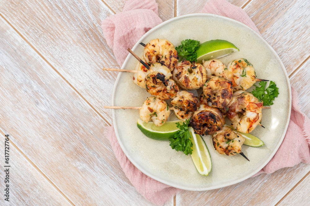 Grilled shrimp skewers. Seafood, shelfish. Shrimps Prawns skewers with lime. Barbecue srimps prawns. Grilled shrimp skewers. Seafood, shelfish. Shrimps Prawns skewers with lime. Barbecue srimps prawns.