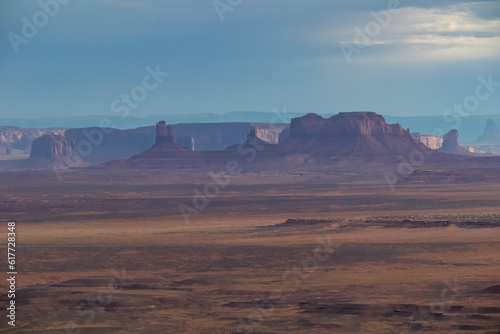 Scenic aerial vistas of desert landscape and canyons of Valley of the Gods seen from remote cliff Muley Point near Mexican Hat, San Juan county, Utah, USA. Monument valley seen in the distance
