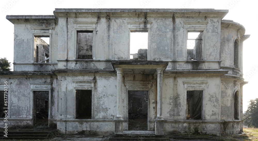 big house decay. Historical building. Old doors and window frames on the building facade. Entrance with stairs and columns. Batumi, Georgia.